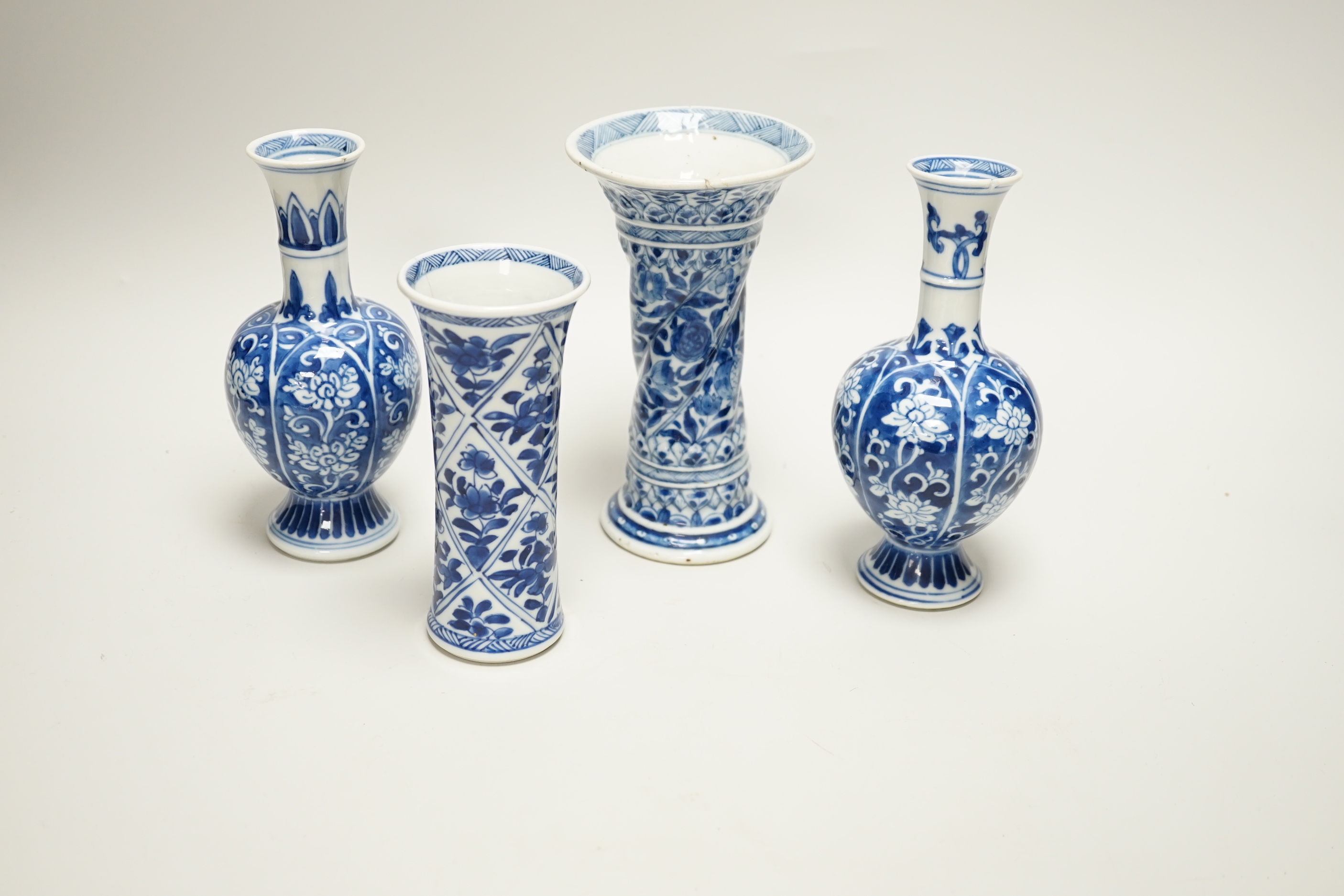 Four Chinese Kangxi period blue and white small vases, tallest 16cm high